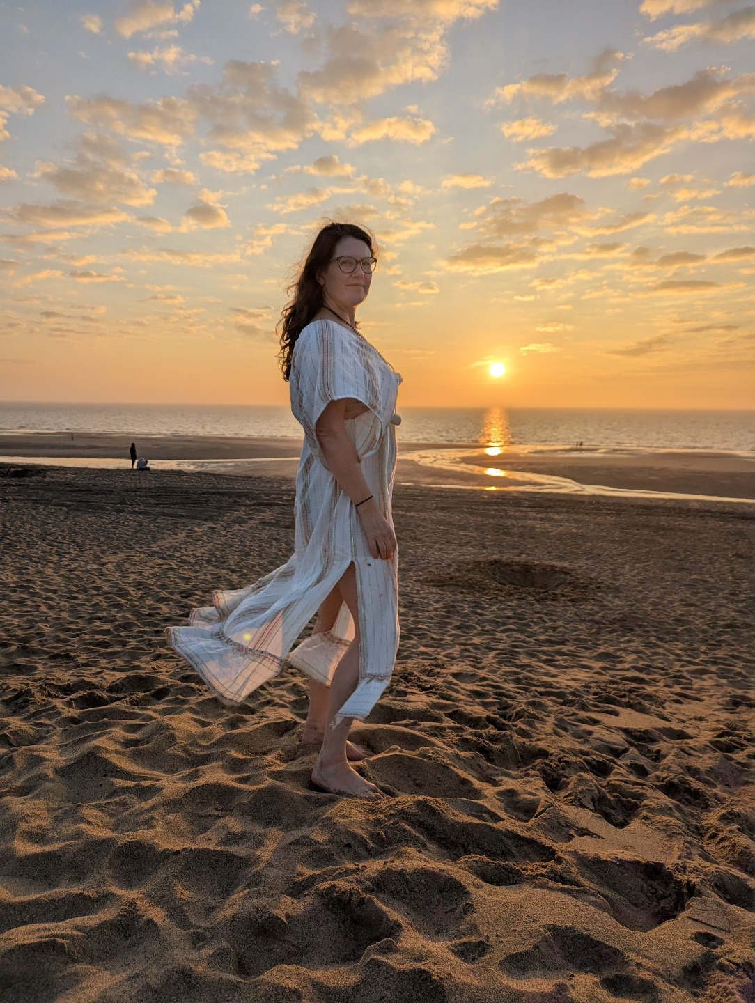 Jules Christian on the beach at sunset