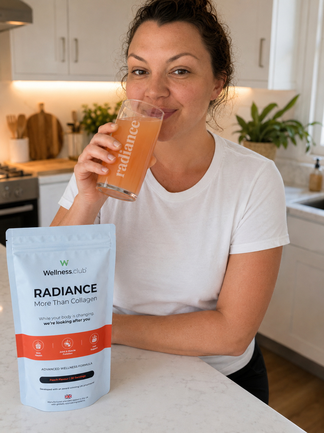 Victoria drinking a wellness drink