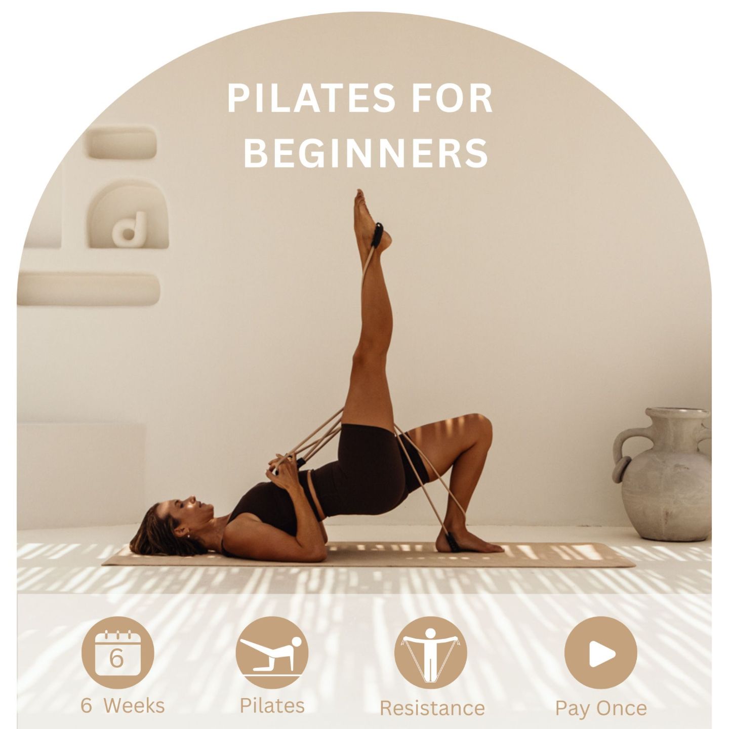 Woman working out on an exercise mat with a reformer band, stretching out her legs 