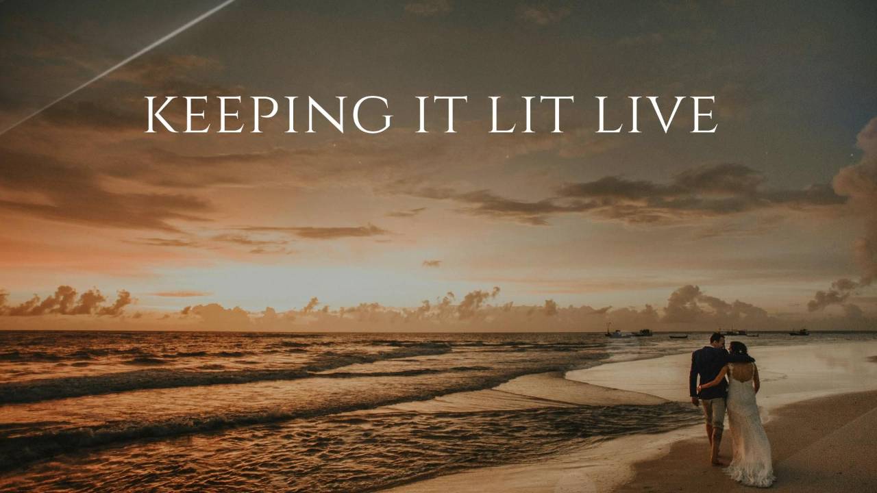 Keeping It Lit Live at sunset with a married couple walking together along the shoreline.