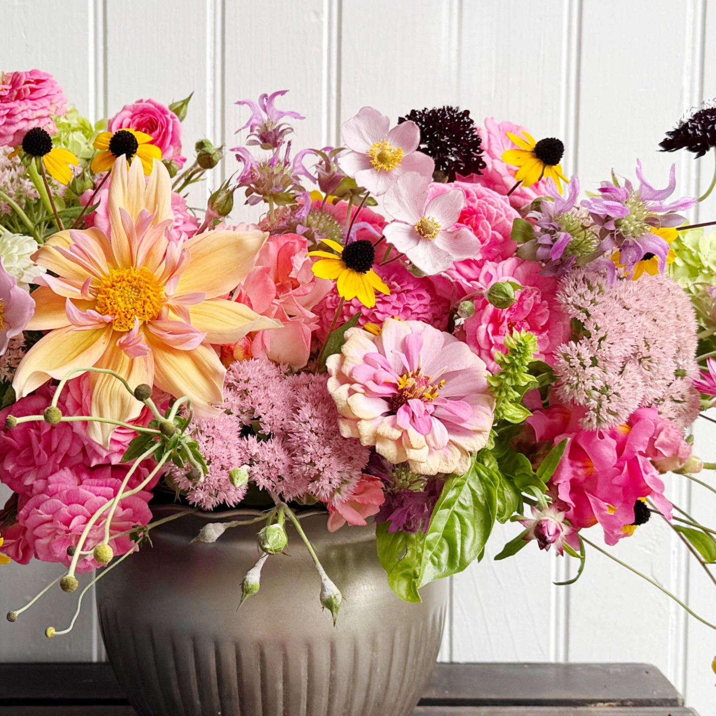 arrangement with dahlias, sedum, zinnias and black eyed susans