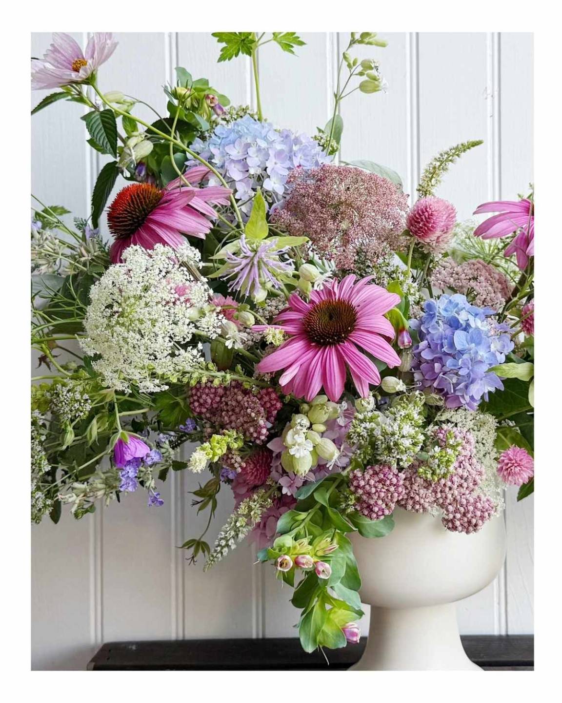 flower arrangement with coneflower - echinacea, queen anne's lace, yarrow, bee balm, hydrangeas, cosmos and more