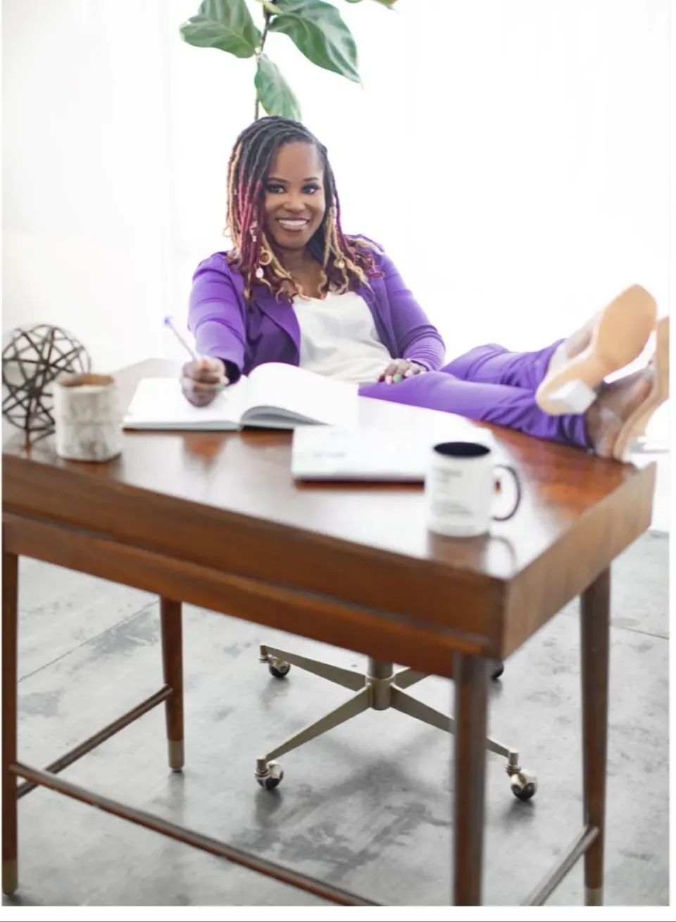 Yvette Howard, LCSW — Private Practice Strategist sitting confidently at her desk, Boss Clinician founder