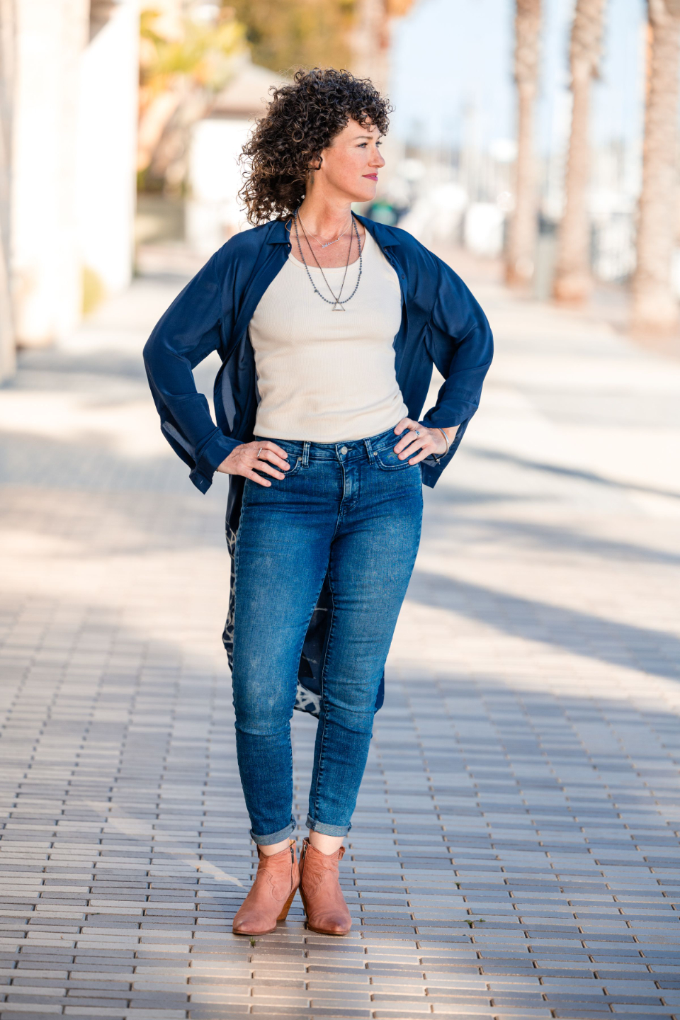 Alanna Kaivalya, Ph.D. in a cowboy hat and boots