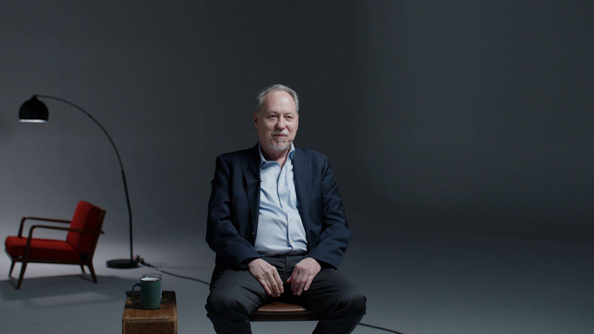 Andrew Tatarsky seated in the studio
