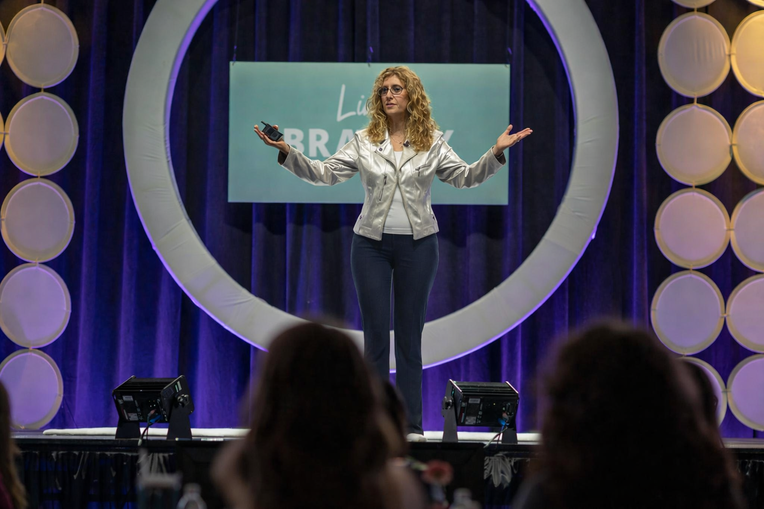 Alyssa Dver keynoting the Women's Leadership Conference in Green Bay