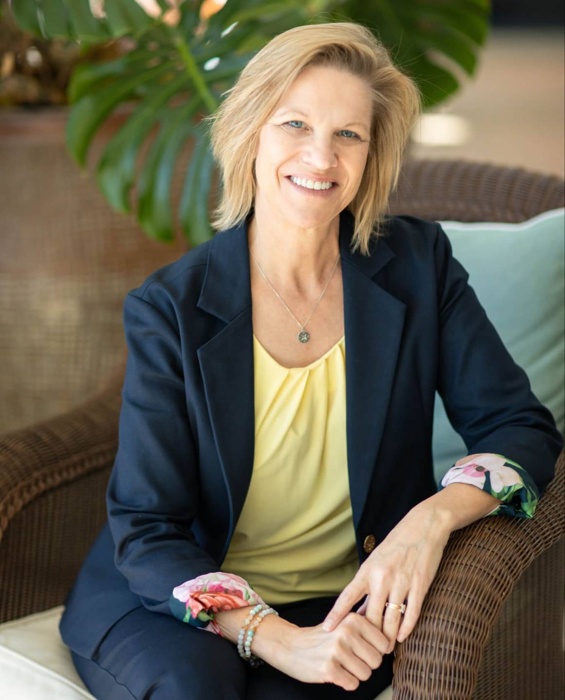 Shari smiling in pink blazer