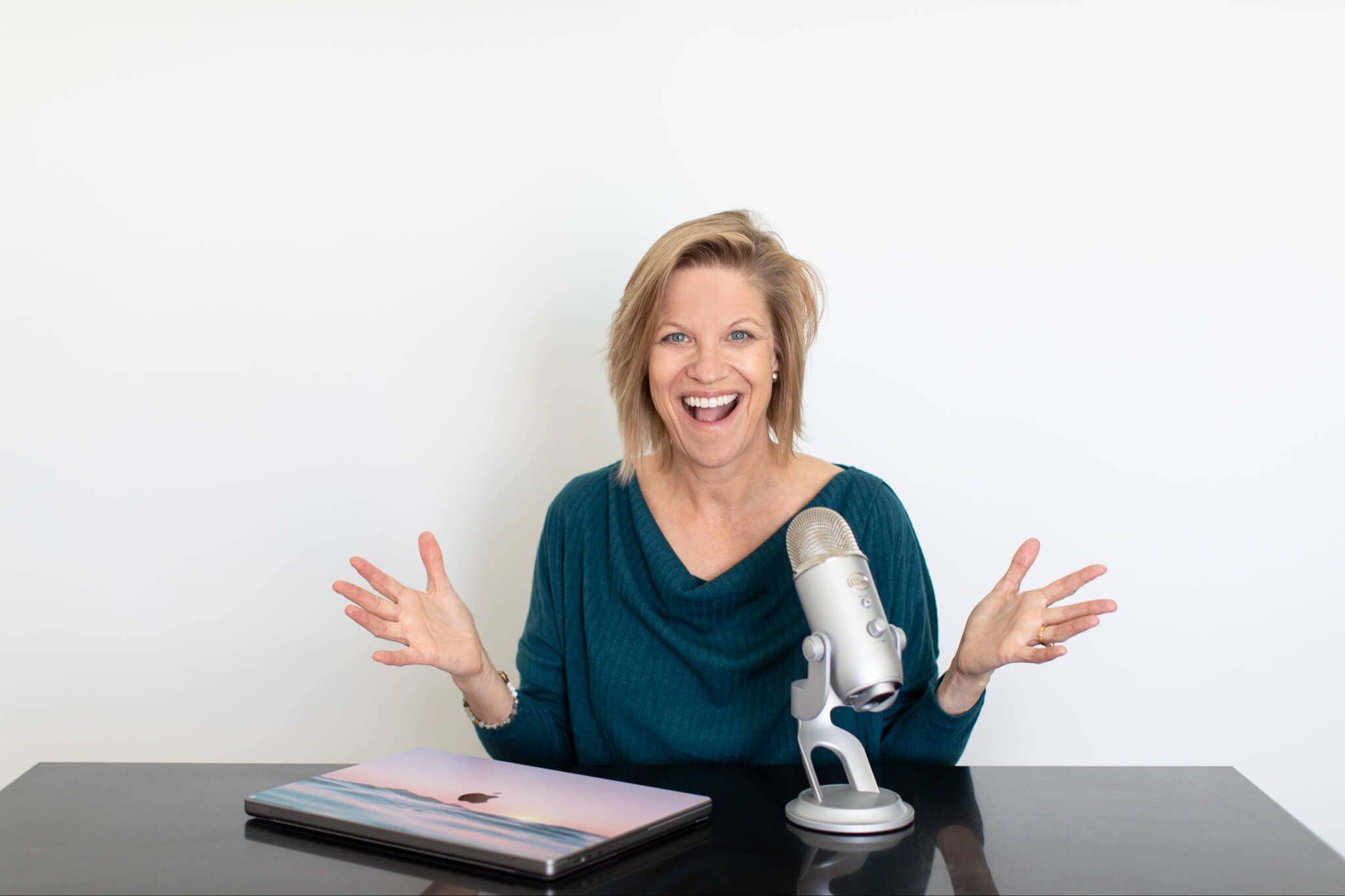 shari with an excited smile and jazz hands