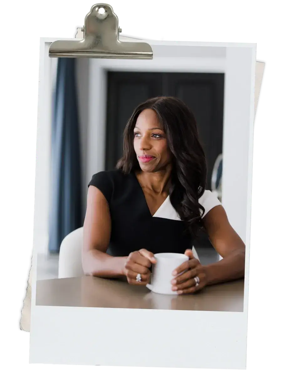 Caroline Flanagan, The Black Lawyers Coach, sitting with a coffee cup during a coaching session