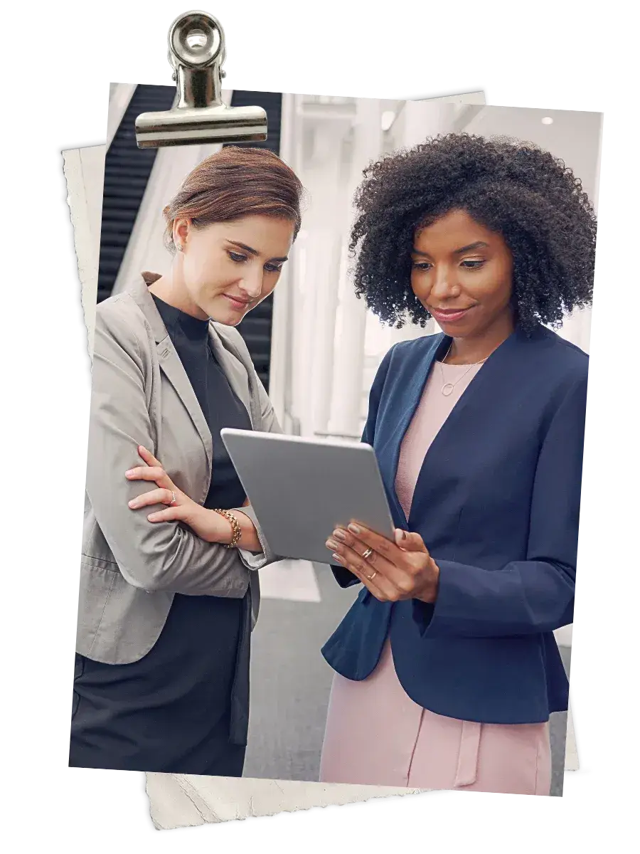 Two female Black lawyers in a business setting building a mentoring and sponsorship relationship