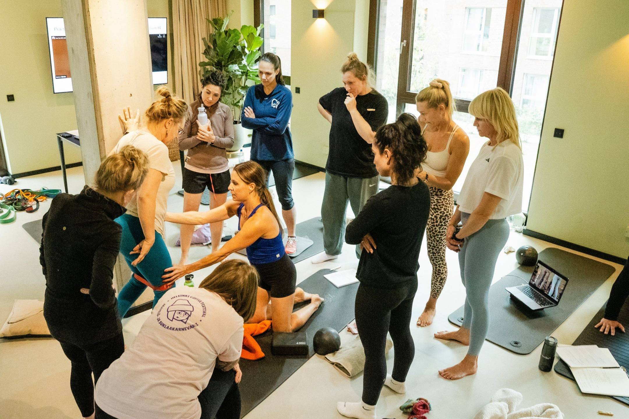 Katie coaching a hands-on assessment during a live Empowered Performance session
