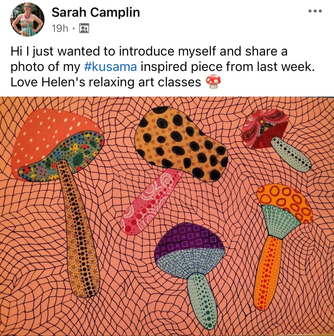 Close-up of an adult student at Create Art School drawing a chandelier in black pen, inspired by colourful reference images in a relaxed classroom setting.