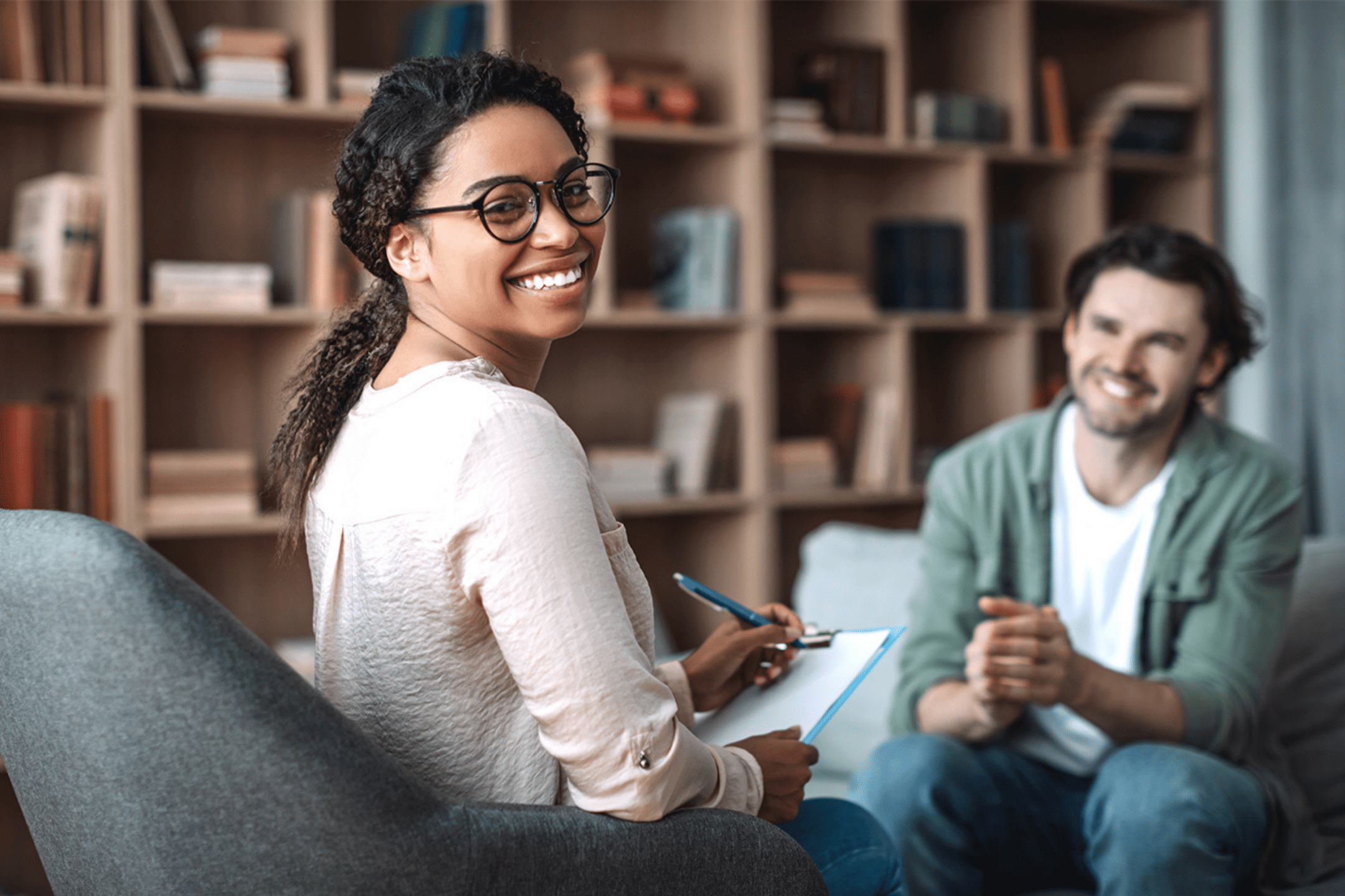 Professional coach having a one-on-one coaching conversation with a client.