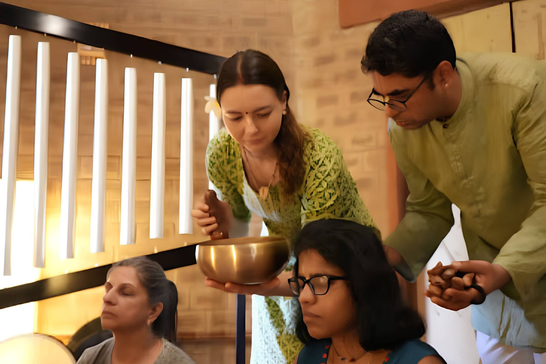 Kaustubha Das teaching yoga philosophy and sacred texts during an outdoor satsang at Govardhan Eco Village in India.
