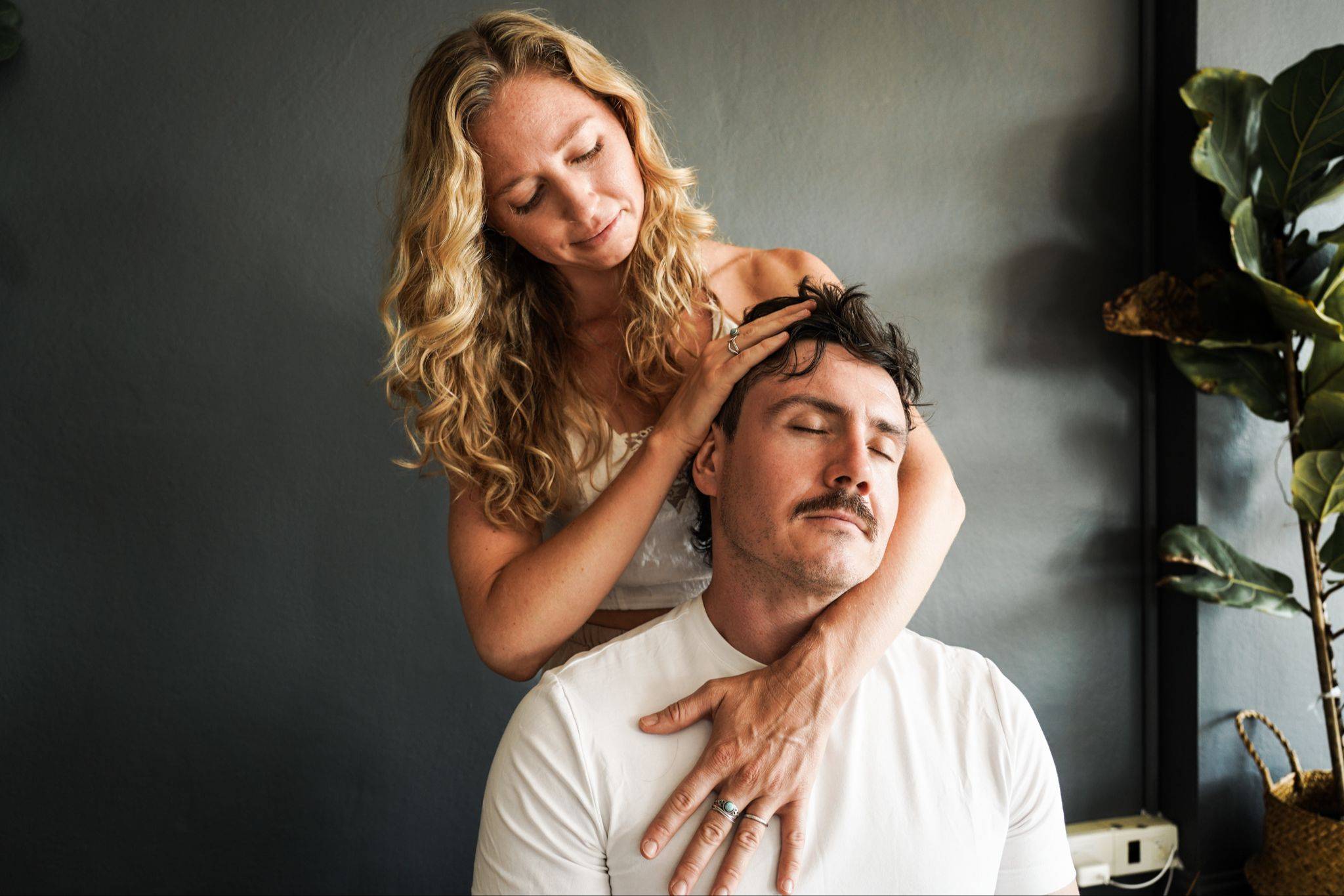 Maeve Downey offering a supportive hands-on somatic session to a client