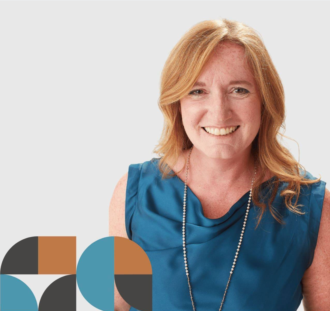 Stephani smiling in a professional portrait, wearing a blue top against a light background with geometric branding.