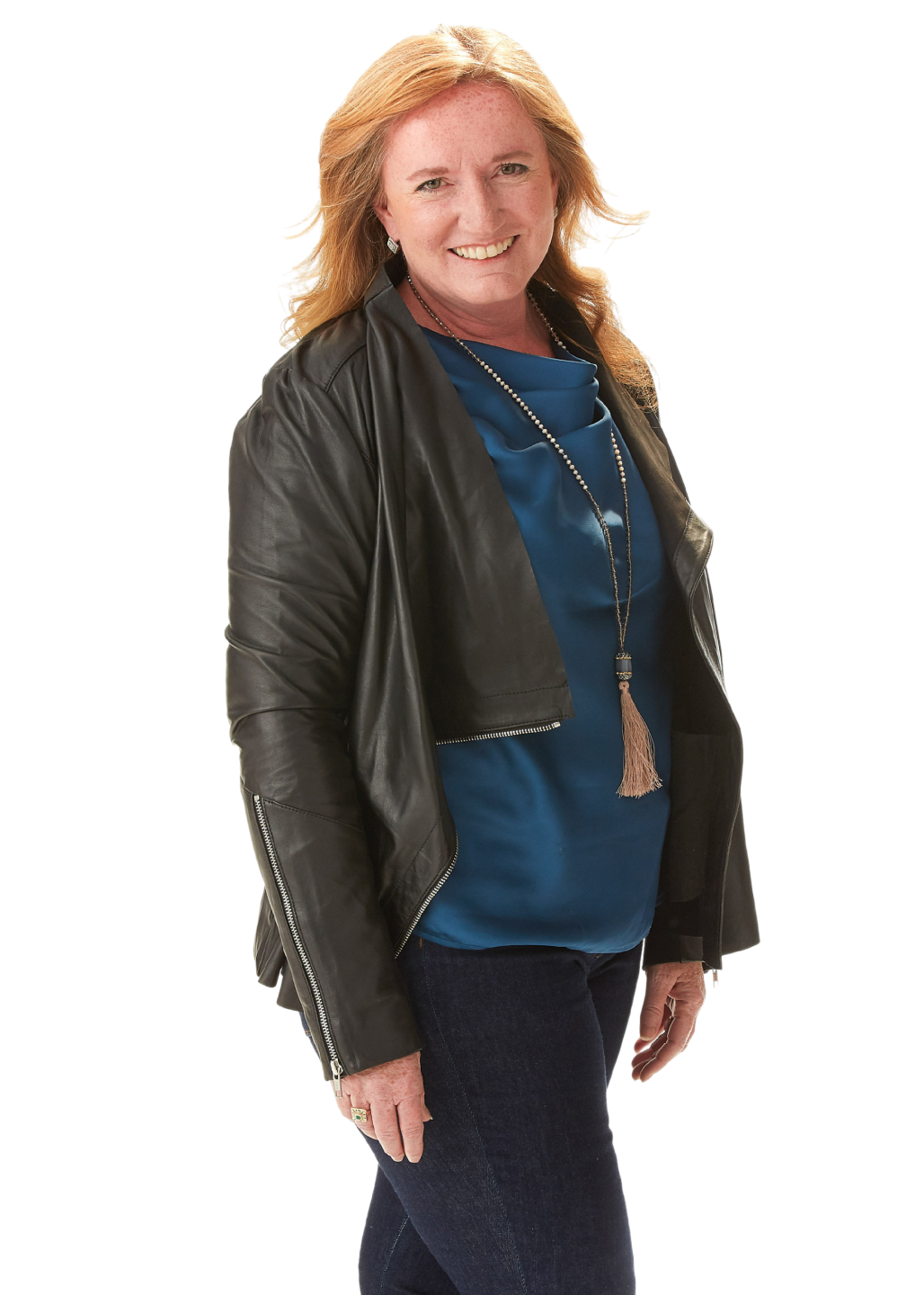 Stephani Roy McCallum smiling in a professional portrait, wearing a black leather jacket over a blue top against a white background.