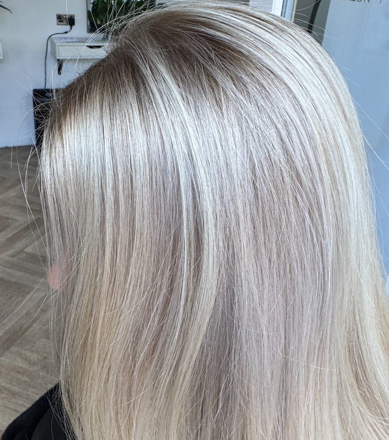 Dimensional blonde hair close-up with a soft seamless finish