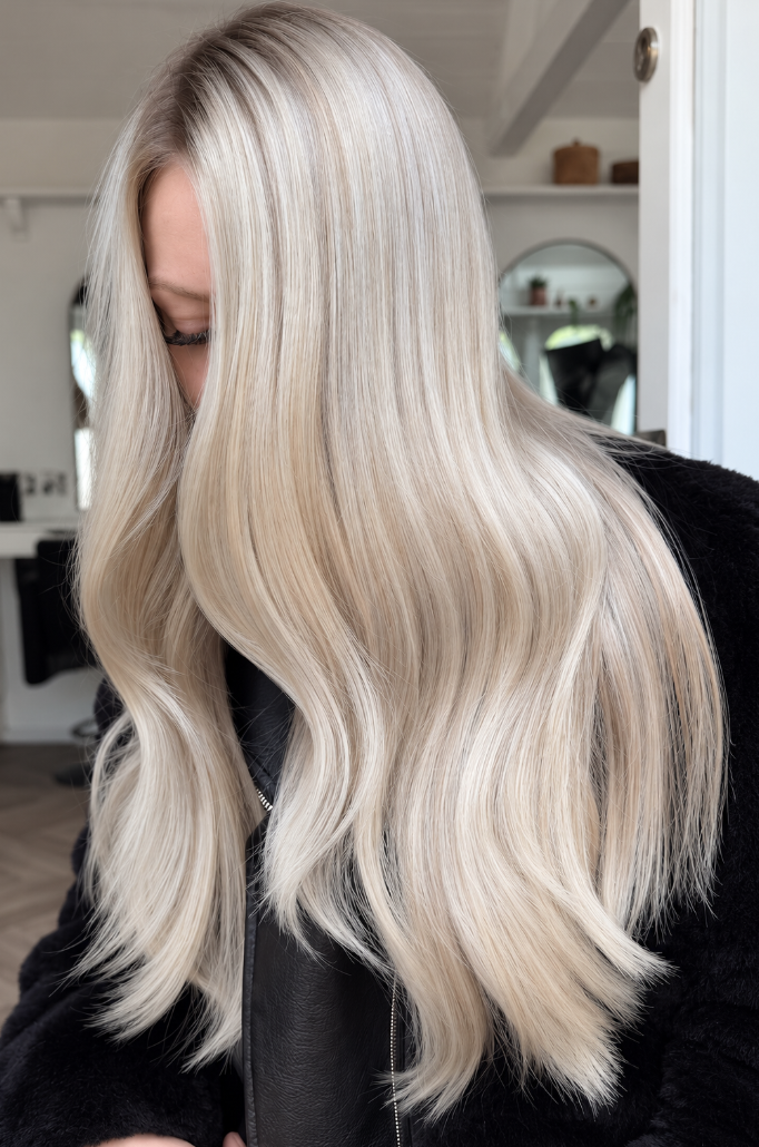 Premium blonde balayage hair detail in soft natural light