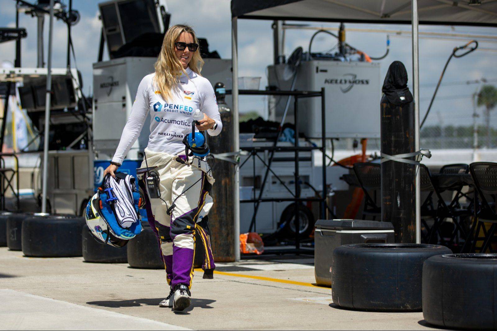 Driver walking through paddock
