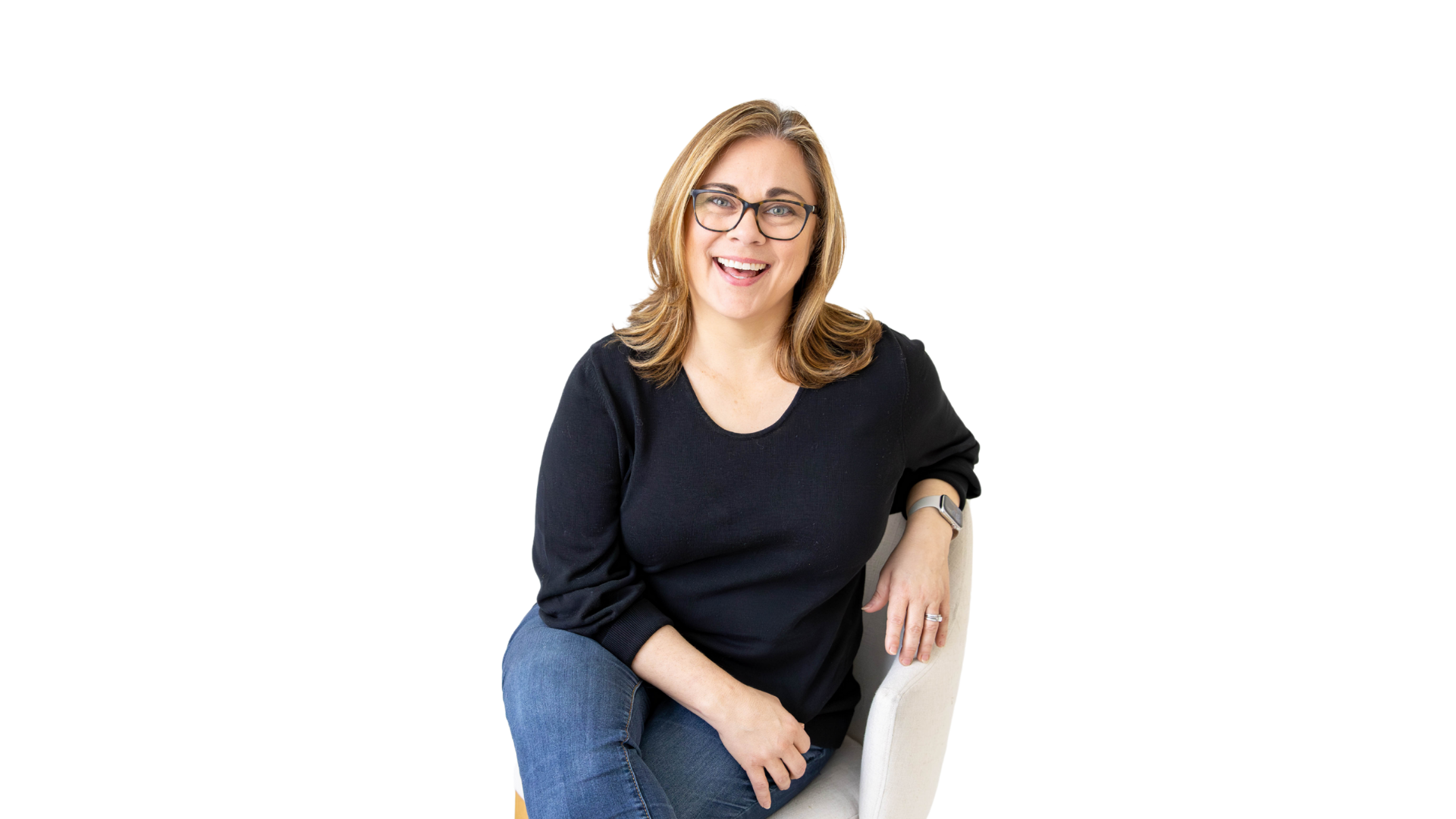 Beth McCord, smiling and seated in a relaxed pose