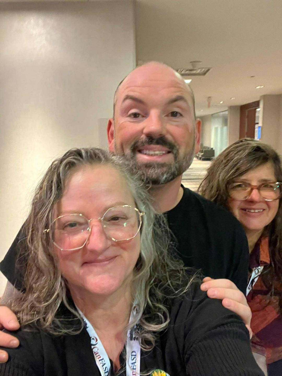 Jeff smiling with Debbie and Rhonda