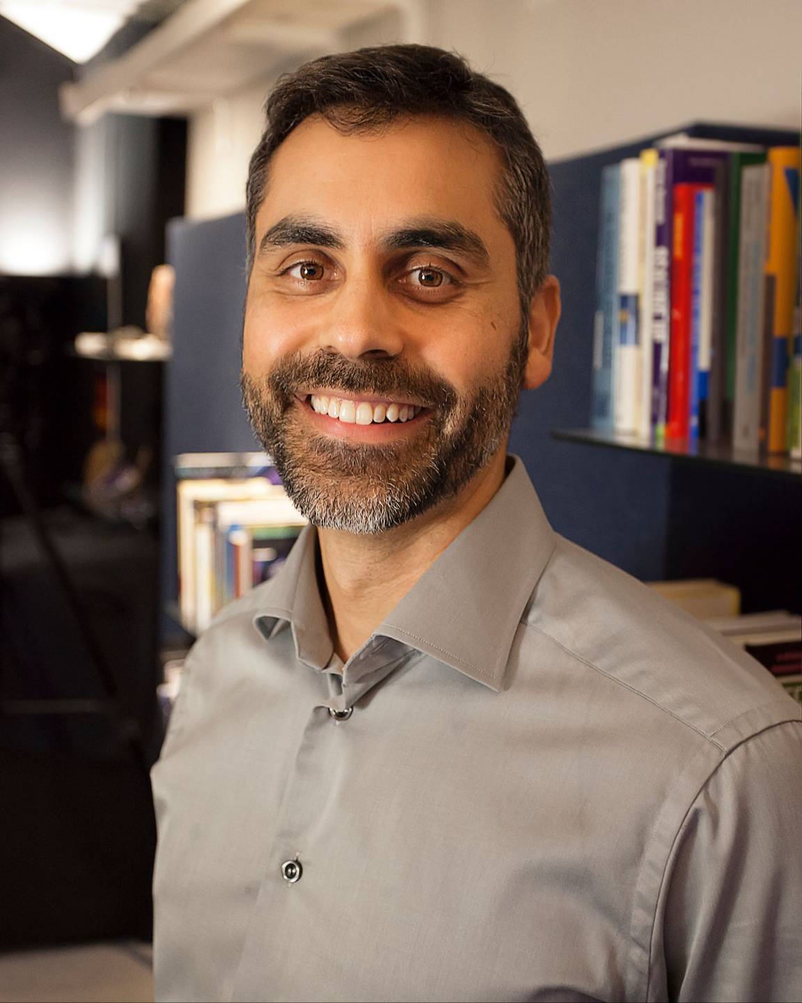Dr. Aziz Gazipura smiling