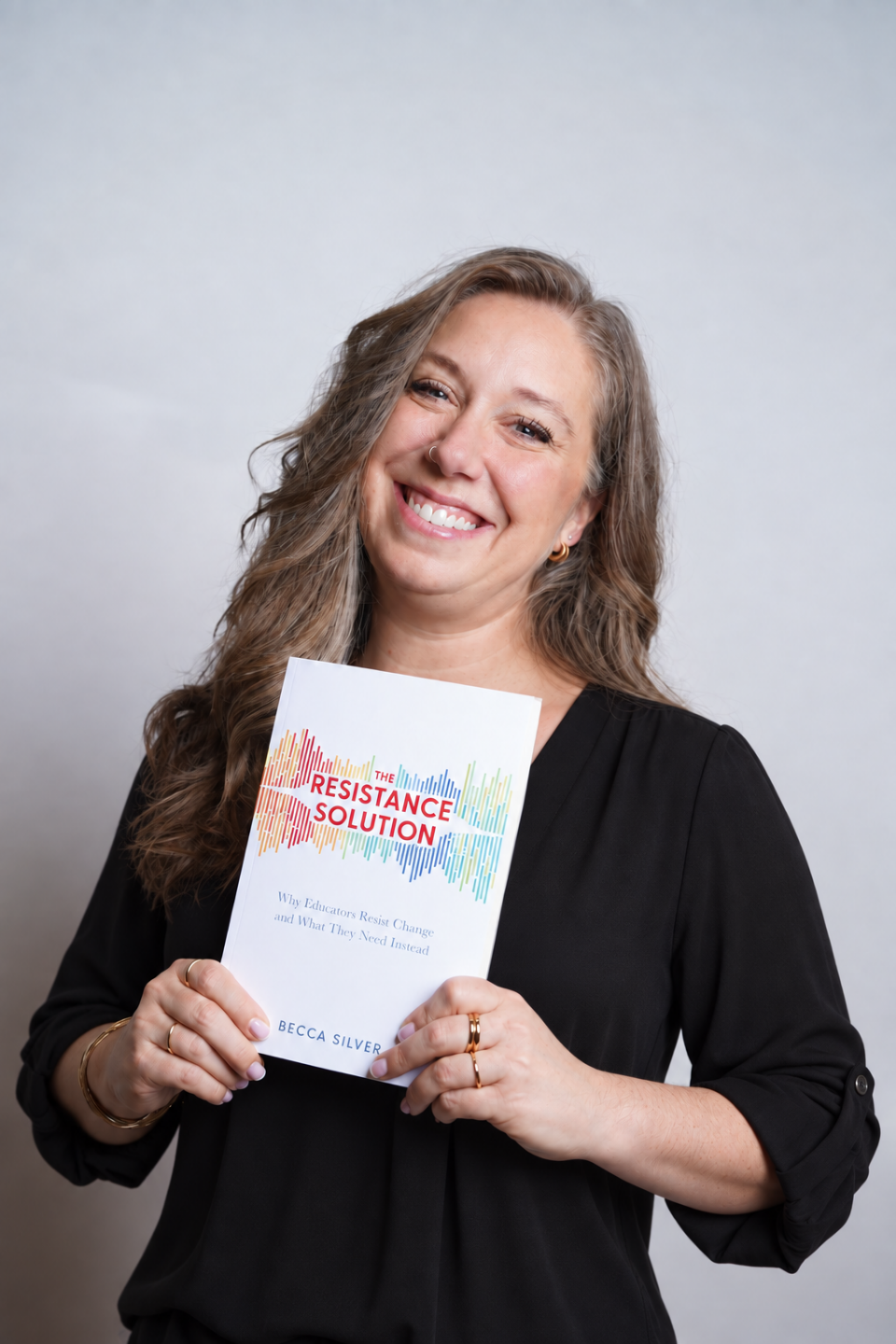 Becca Silver holding her book, The Resistance Solution