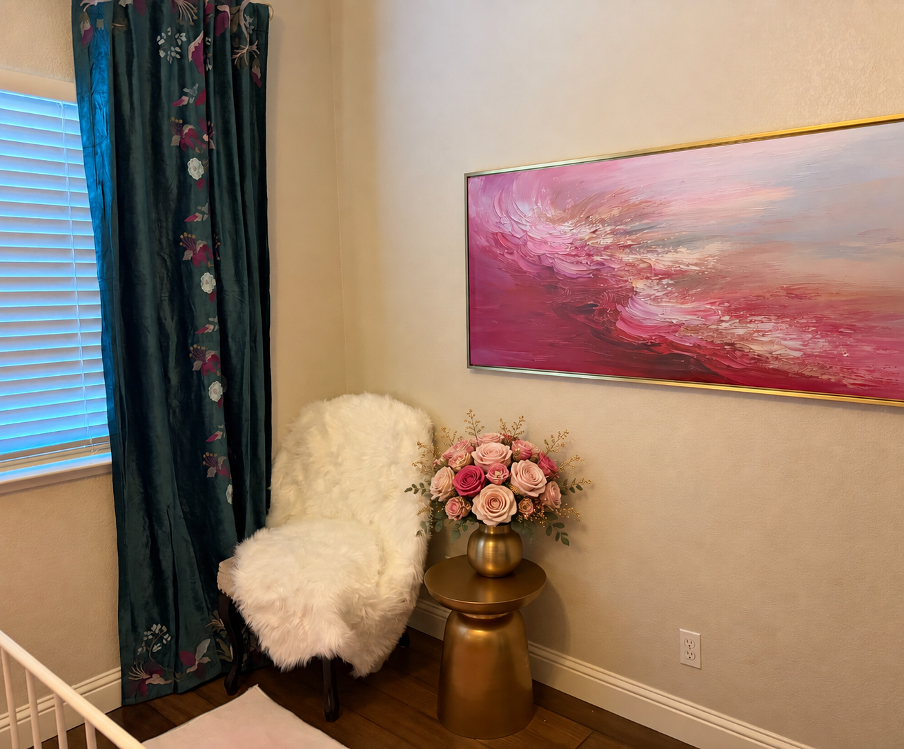 Corner of the Jophiel room with a pink abstract painting, white fur chair and gold vase of roses