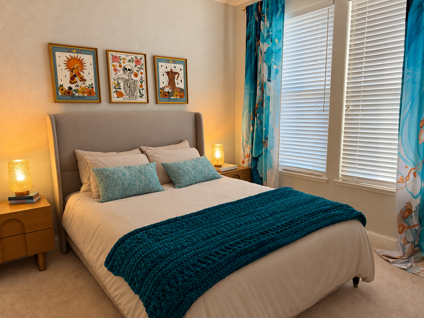 The Archangel Sandalphon guest room with a teal throw, turquoise curtains and warm bedside lamps