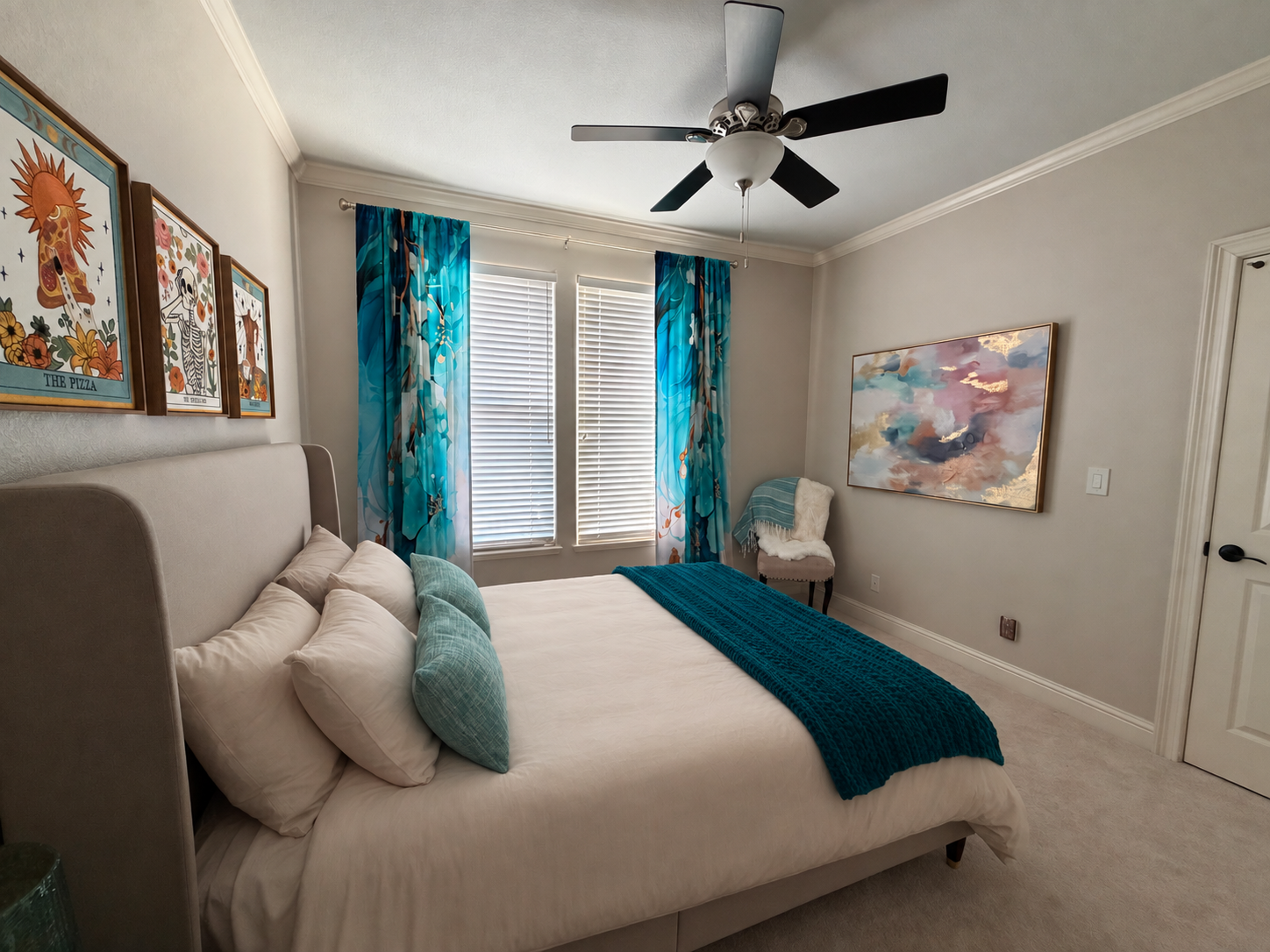 Another view of the Sandalphon room with a reading chair and abstract art