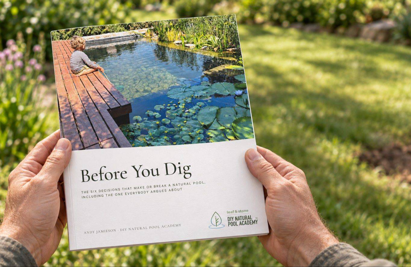 Before You Dig, the natural pool planning pack, held open in a garden