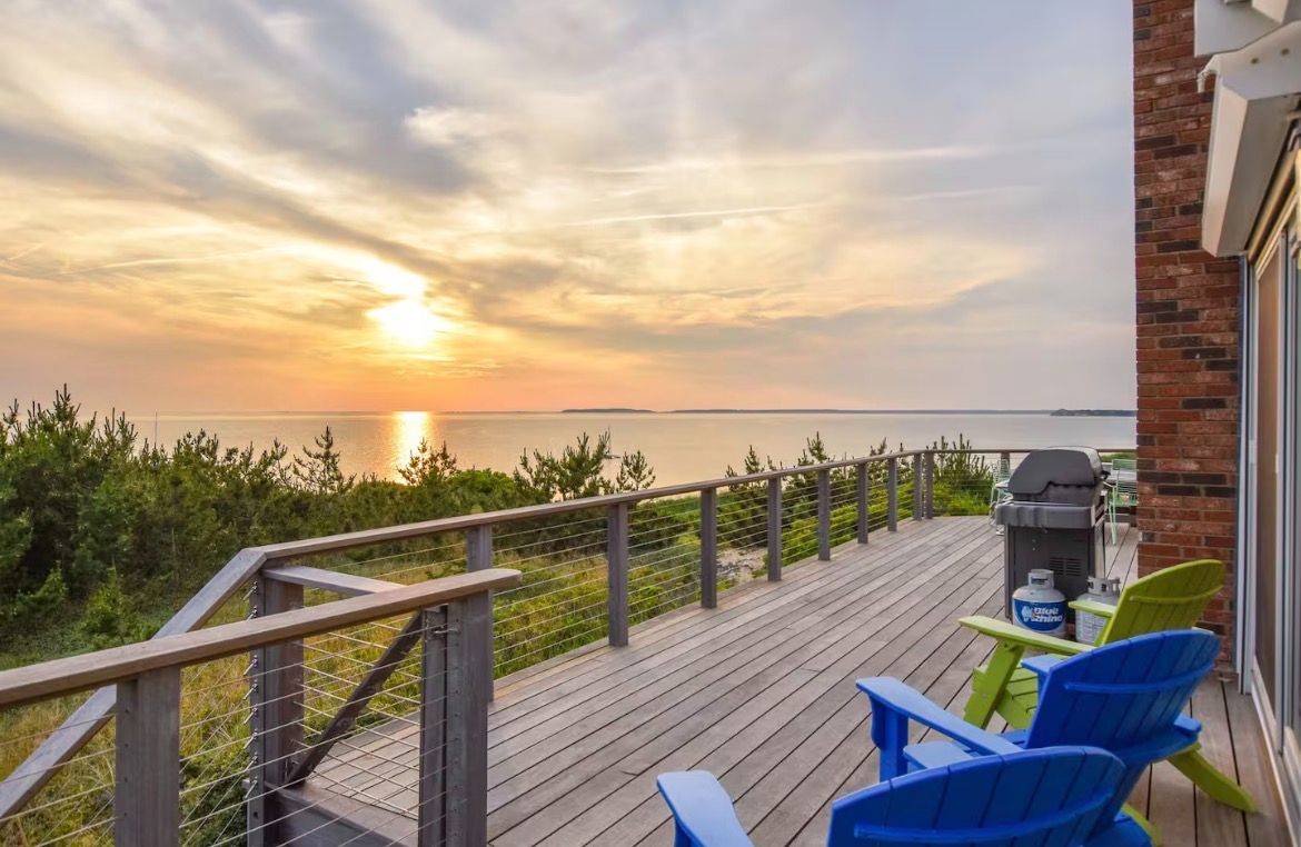 Sunset over the water from the retreat home’s Cape Cod deck