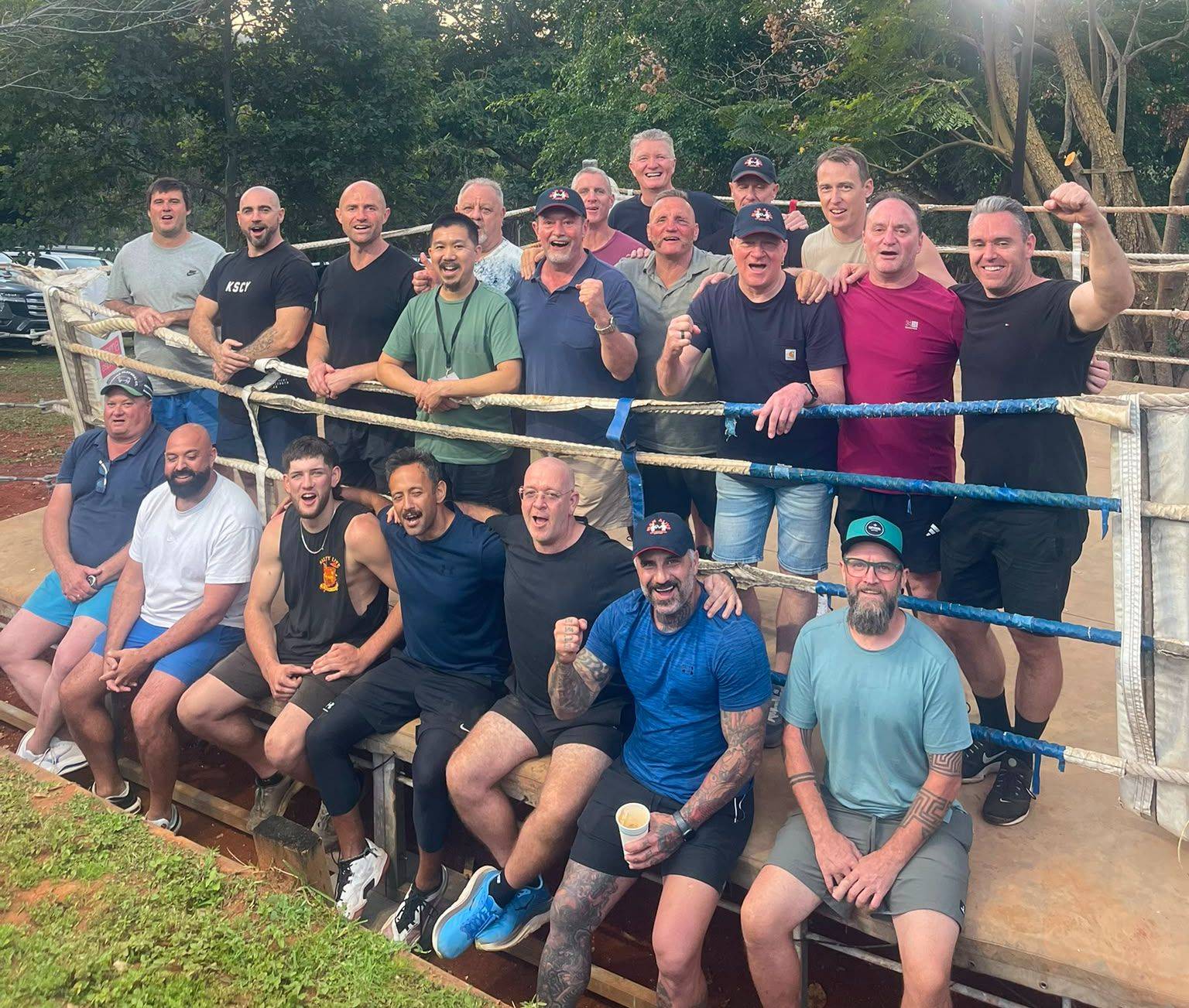 Men gathered outdoors for a Rite of Passage session