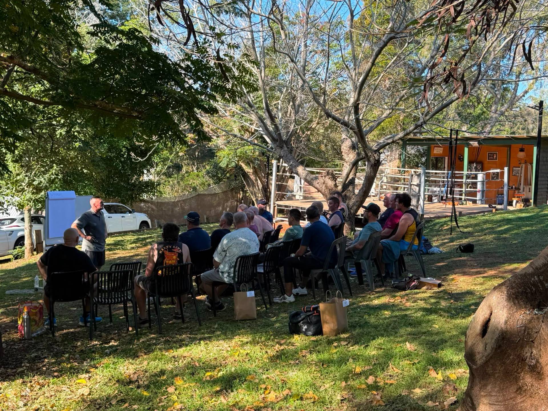 Men in a mentorship session under cover