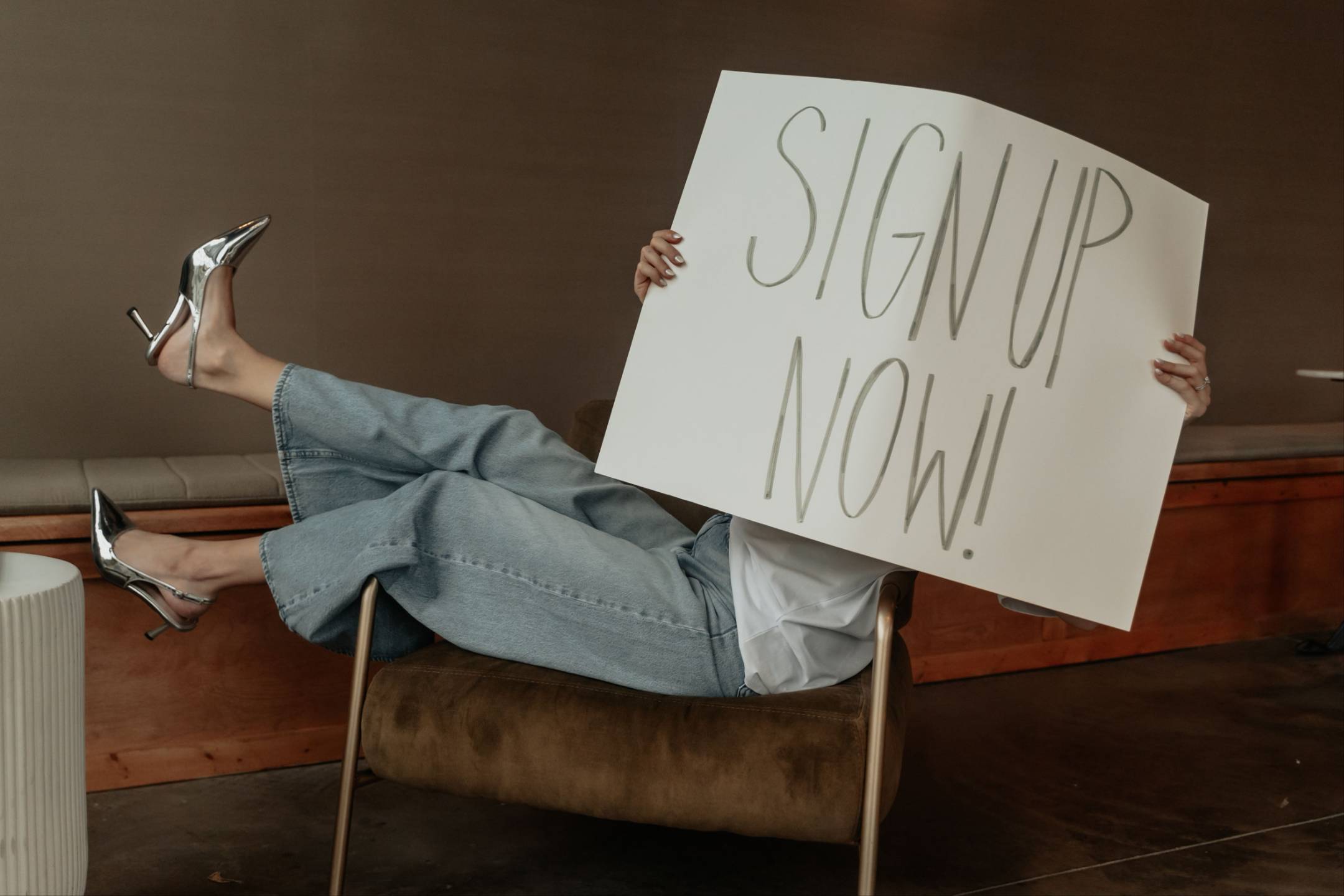 Photo of a poster saying, "Sign Up Now!"
