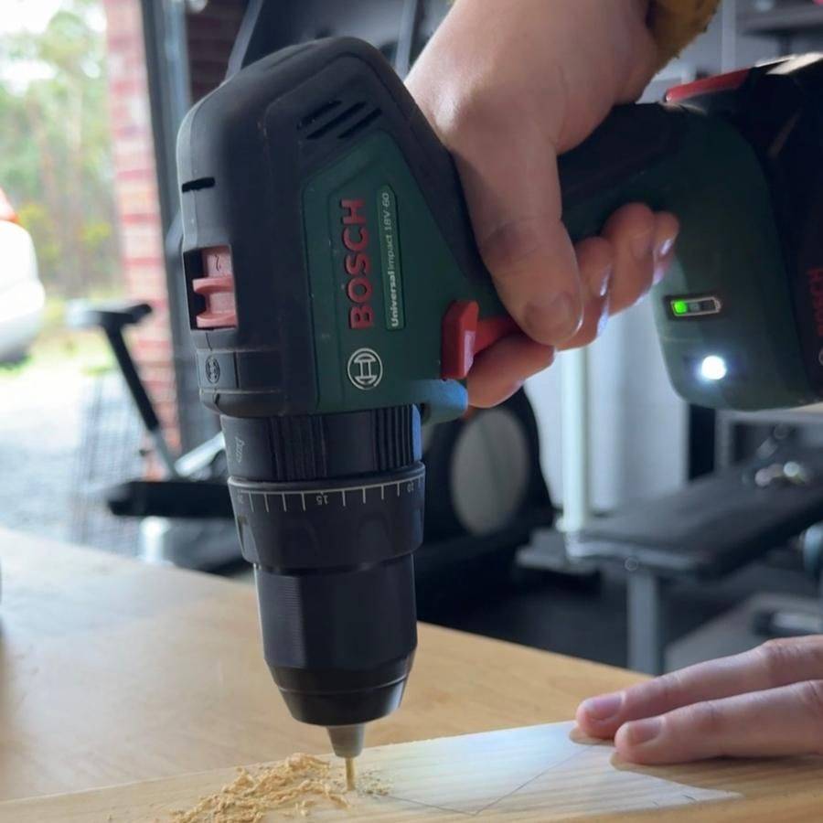 Drilling a pilot hole into timber