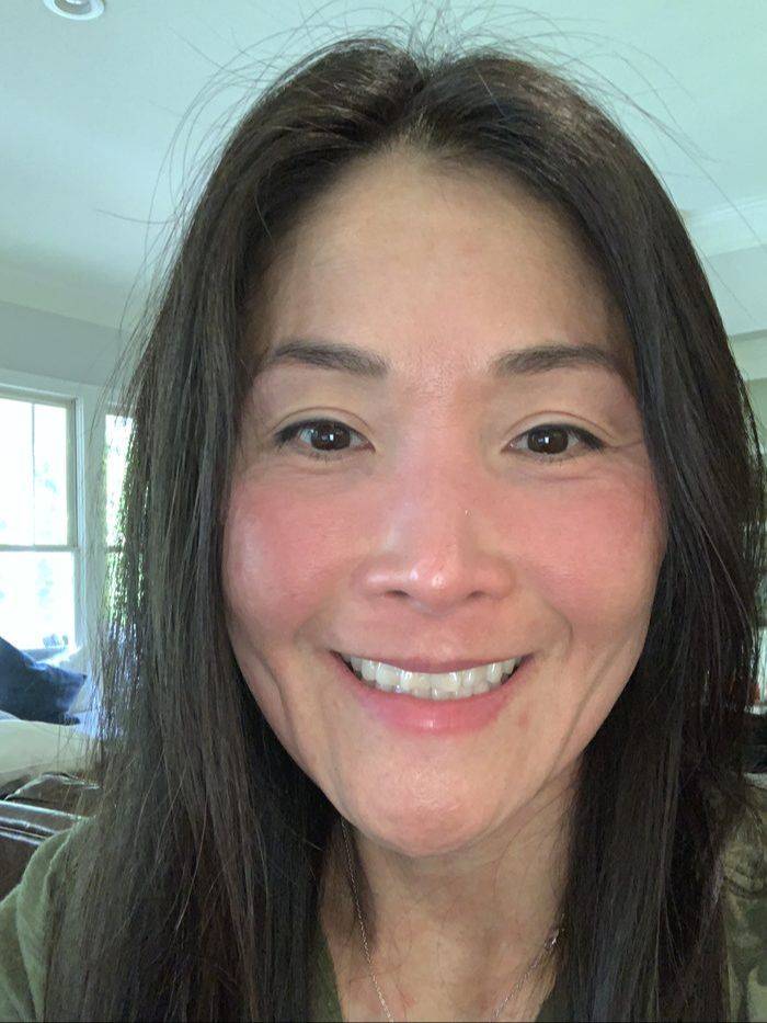 Dr. Connie Cheung smiling at home, no makeup