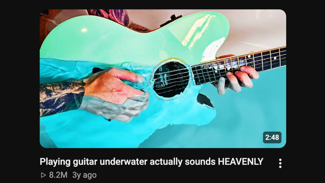 Bernth playing guitar underwater