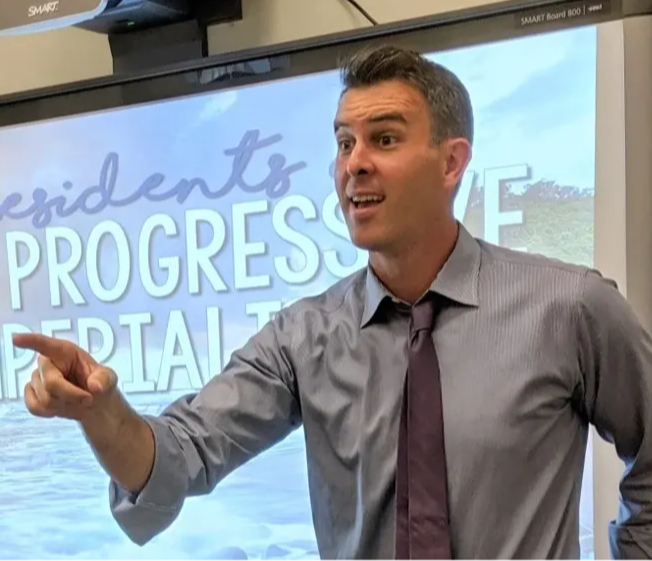 Teacher instructing with interactive digital resources