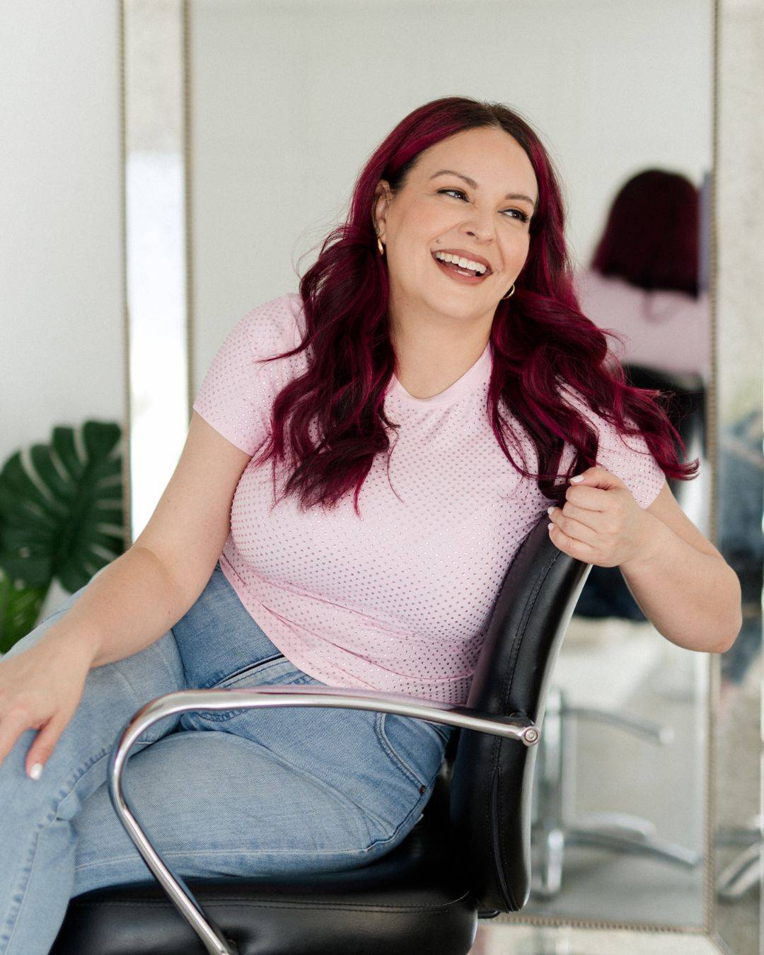 Mirella Manelli sitting in a salon chair