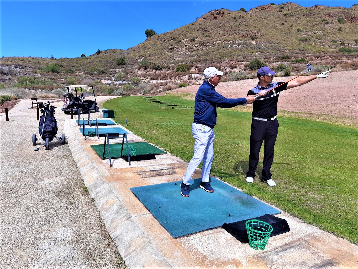 Roy coaching his father on the practice ground
