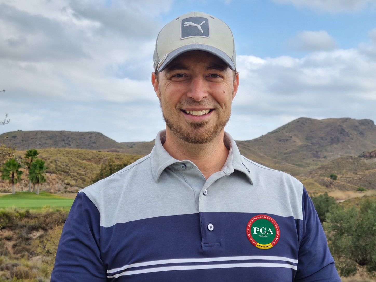Roy Kullick smiling on the golf course