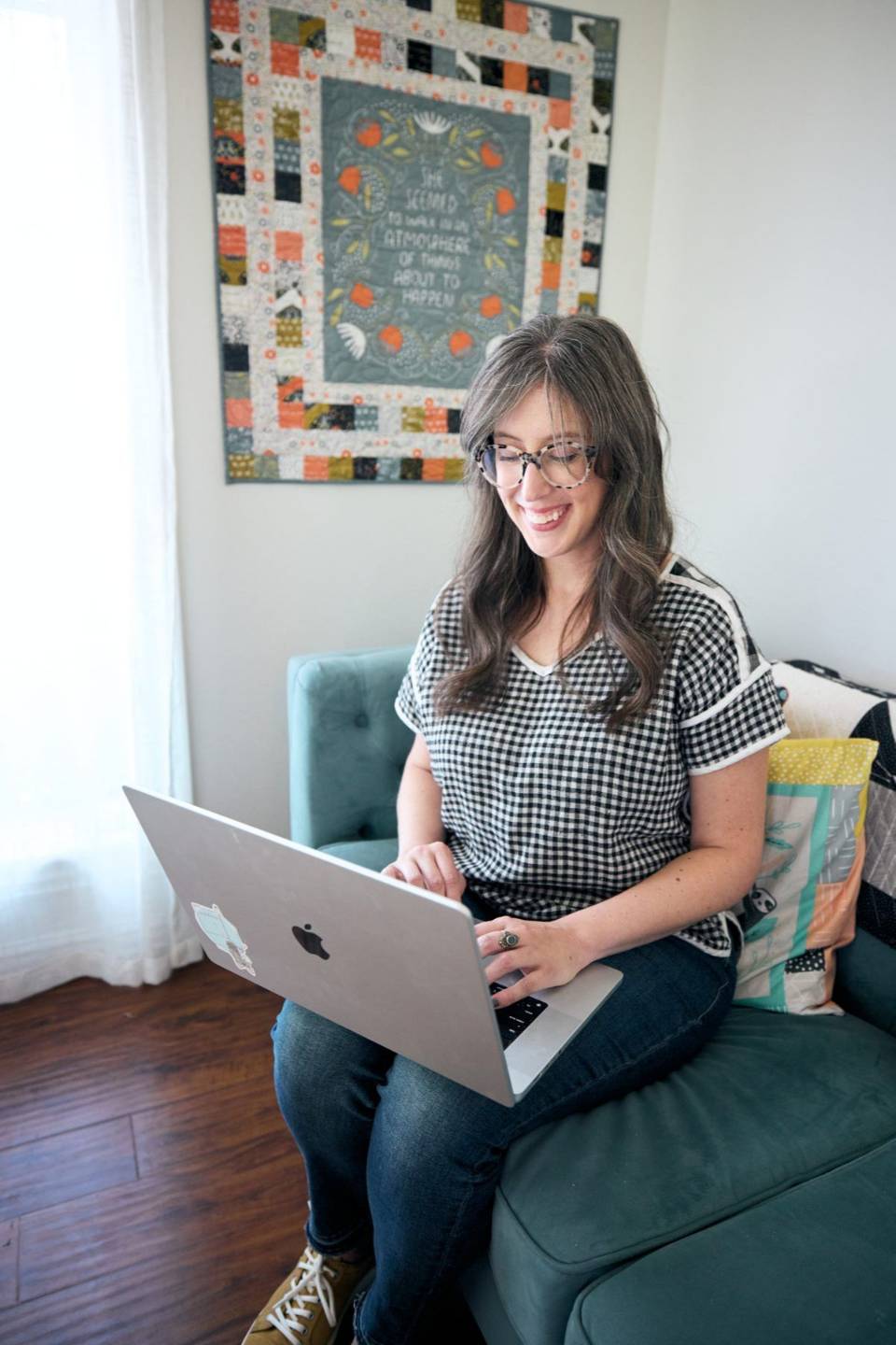 Stacie Bloomfield working on her laptop