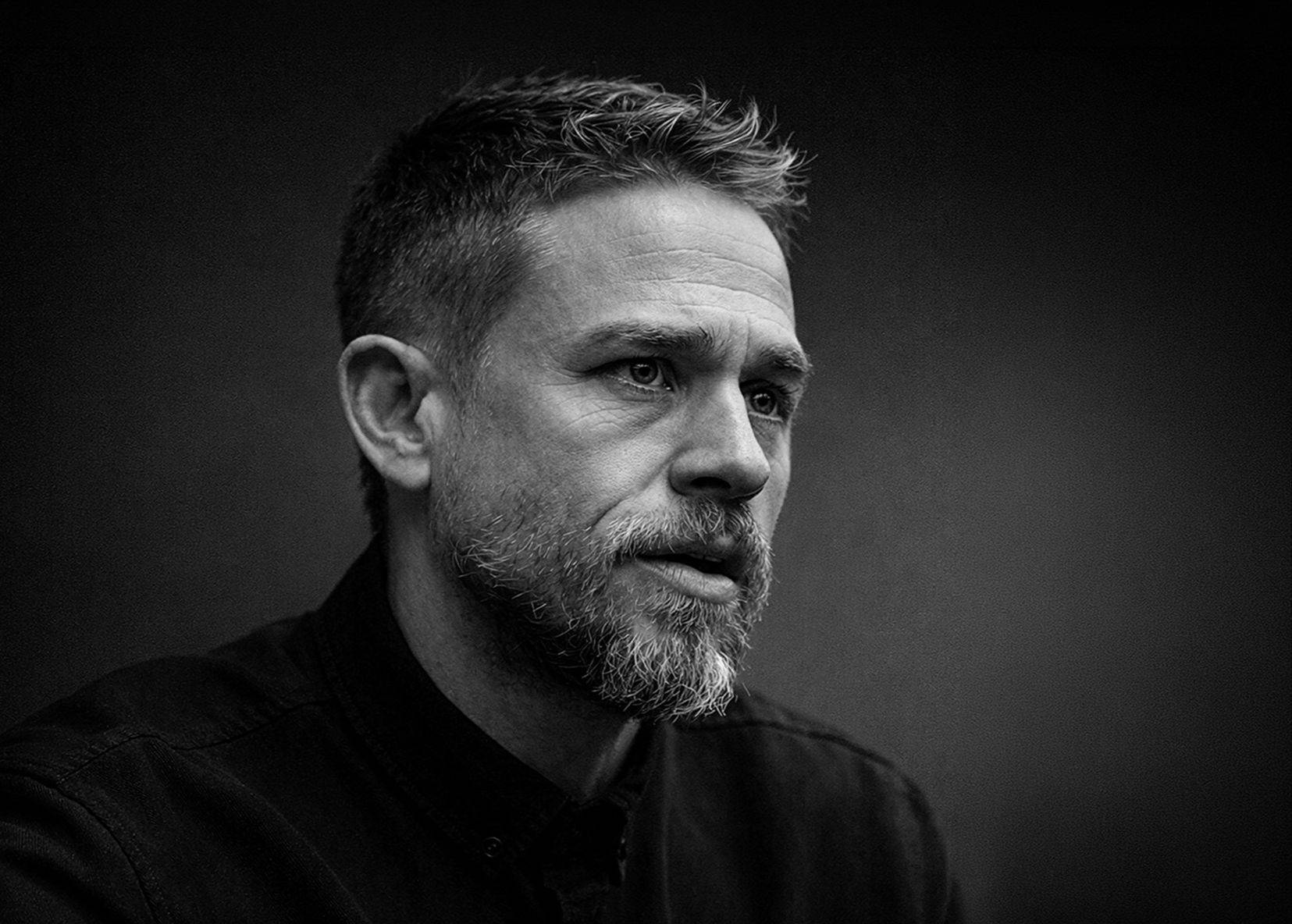 Charlie Hunnam low-key black and white portrait, portrait photography by Mark Kaye