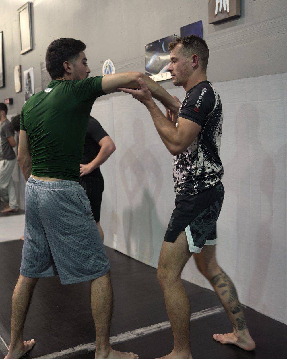Professor Darien Cobon demonstrating a self-defense technique against a punch