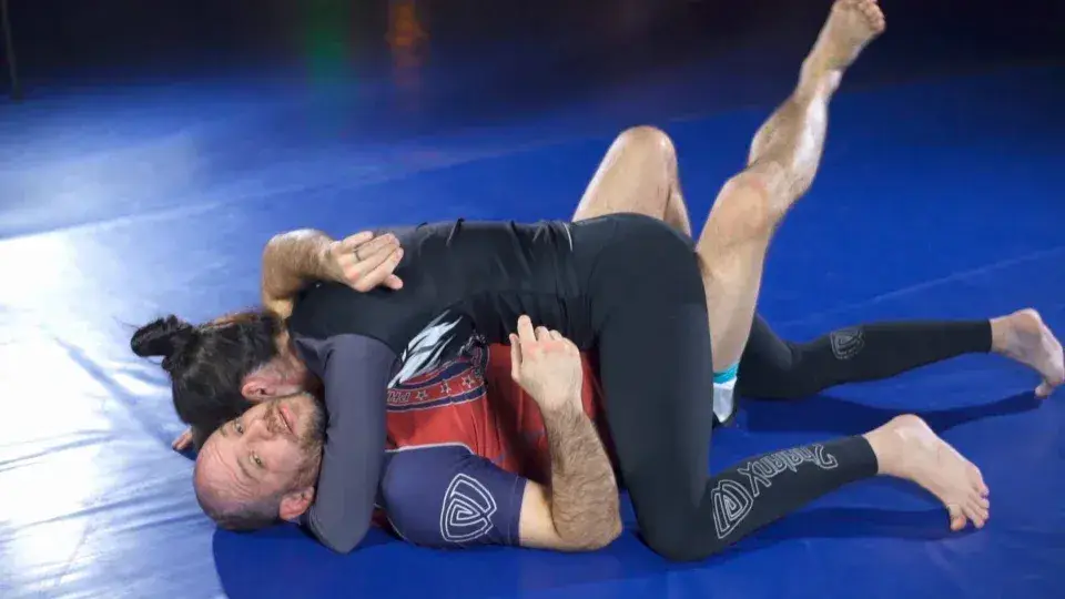 Brandon McCaghren demonstrating the Lockdown half guard with a training partner