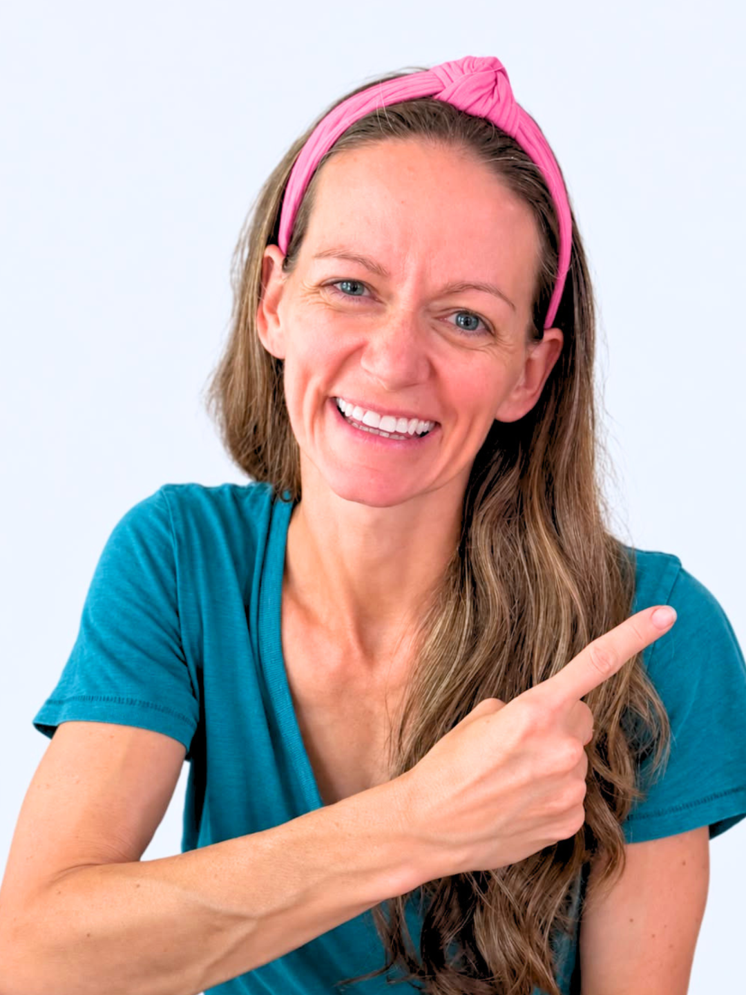 Ashley smiling and pointing toward the challenge sign-up