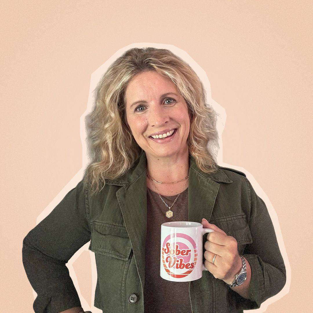Courtney Andersen holding a Sober Vibes mug