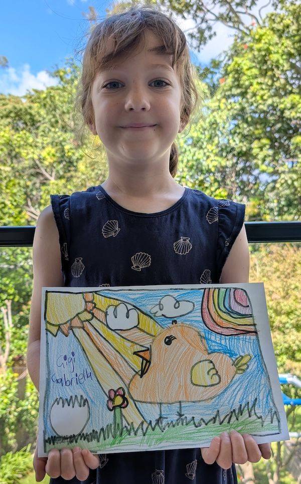 Gabriella, age 6, holding her Artventure artwork of a spring chick